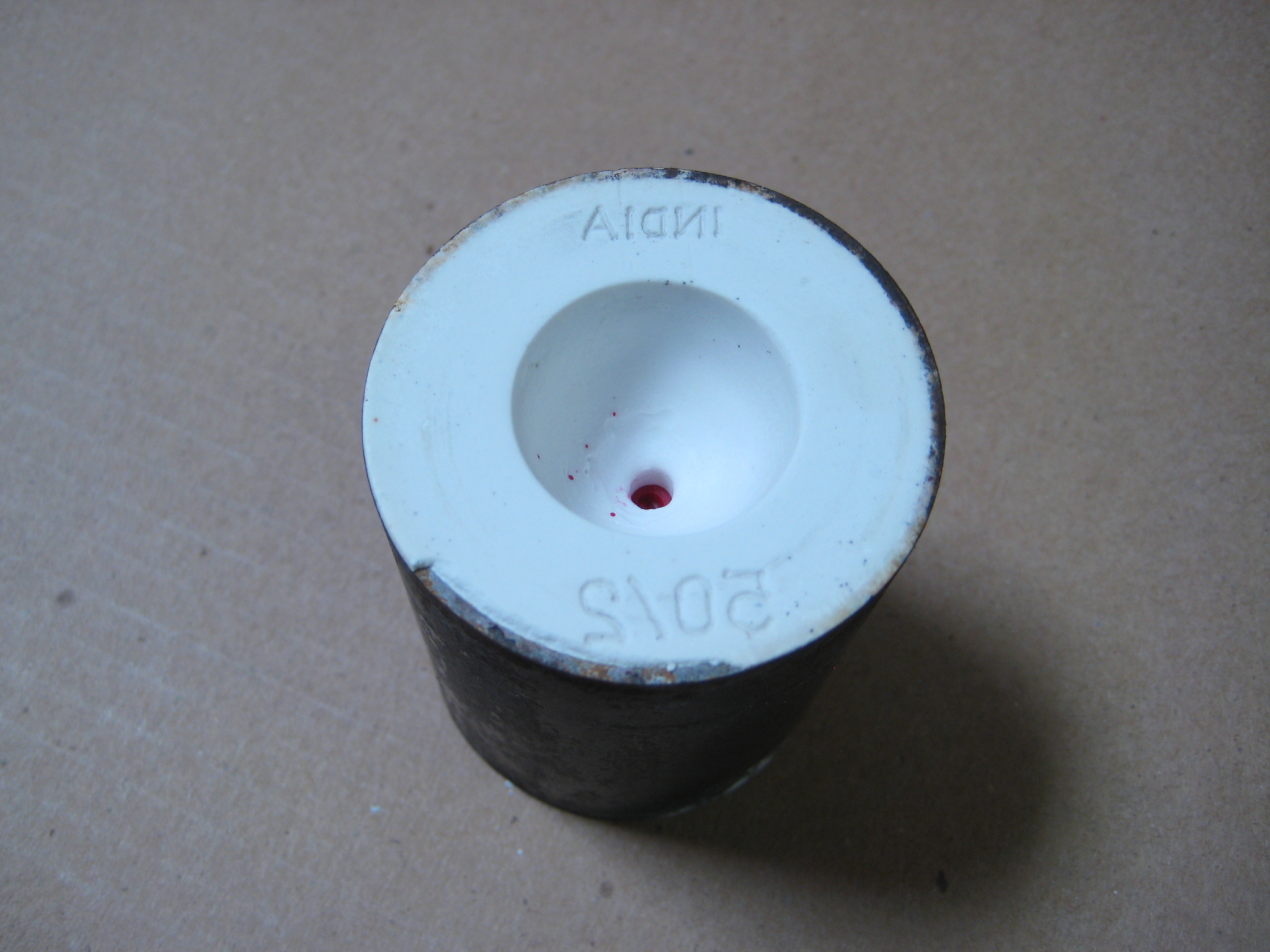 Casting image #5 An image of a wax model, invested in plaster and ready for the burn out