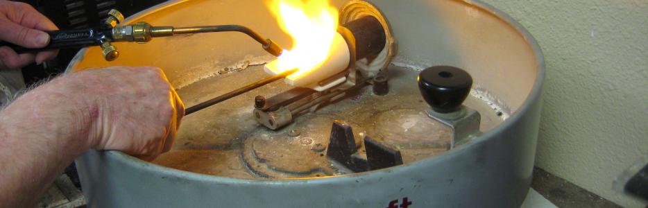 I am now stirring the gold to distribute the alloy metals and preparing to spin the centrifuge.