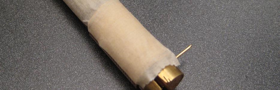 The wire has been wrapped around the mandrel and has been taped to hold it firm.
