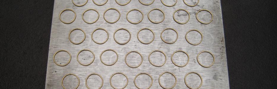 All of the links needed for two inches of finished chain are laid out and ready for fusing