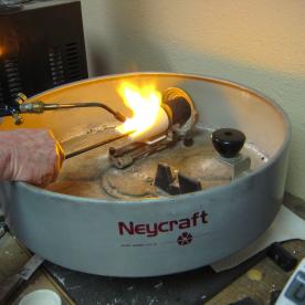 I am now stirring the gold to distribute the alloy metals and preparing to spin the centrifuge.