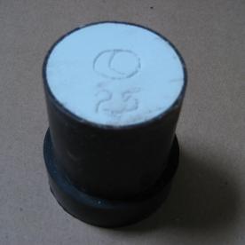 An image of a wax model, invested in plaster and ready for the burn out