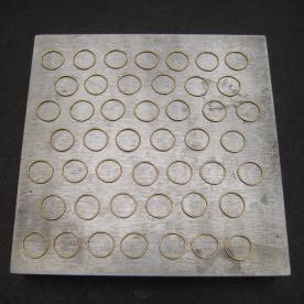 Roman Chain Image #6 All of the links needed for two inches of finished chain are laid out and ready for fusing