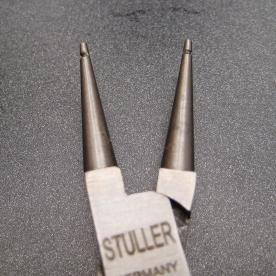 The modified tips of a standard chain nosed pliers.