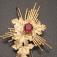 Detail of the sunburst portion of a fabricated gold pendant.